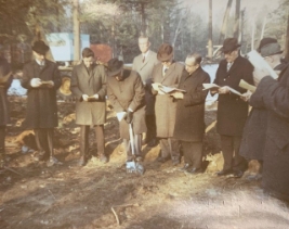 1967 picture of a group of men with a shovel breaking ground to start the build of Rockridge.