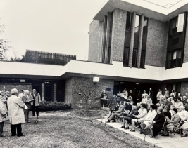 1970 black and white image of people gathered outside of the new Rockridge building to celebrate its grand opening.