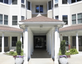 Exterior building with a long covered pathway to the entrance of one of the Rockridge buildings.