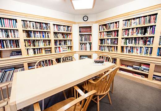 Library with long table and chairs.